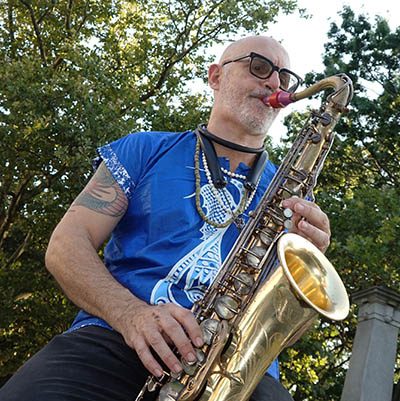 Marco Chelo playing saxophone with DafinaRoots Band