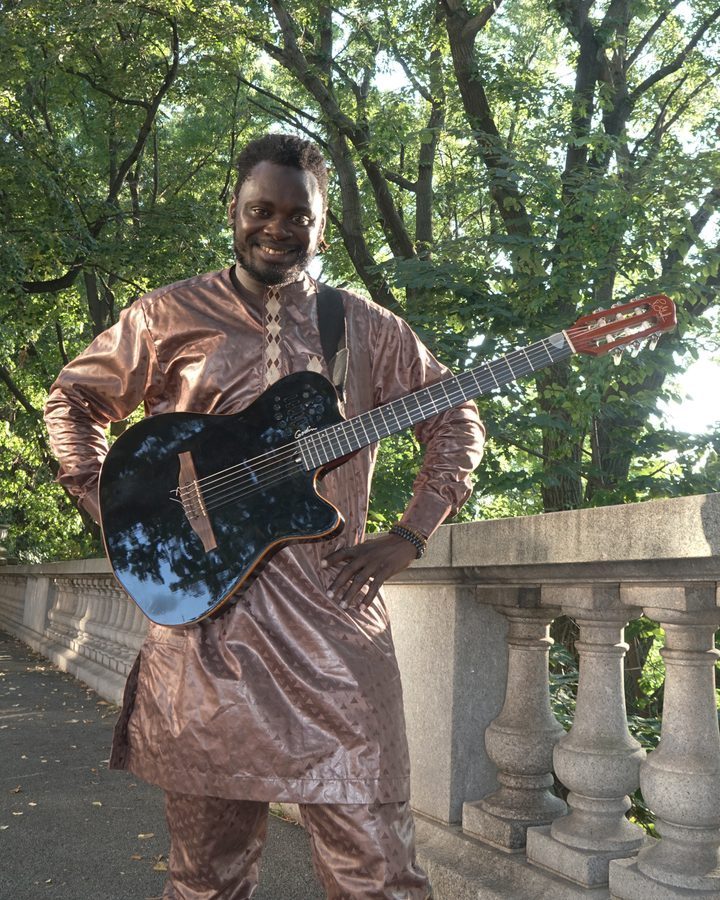 Moussa Drame playing West African guitar with DafinaRoots Band